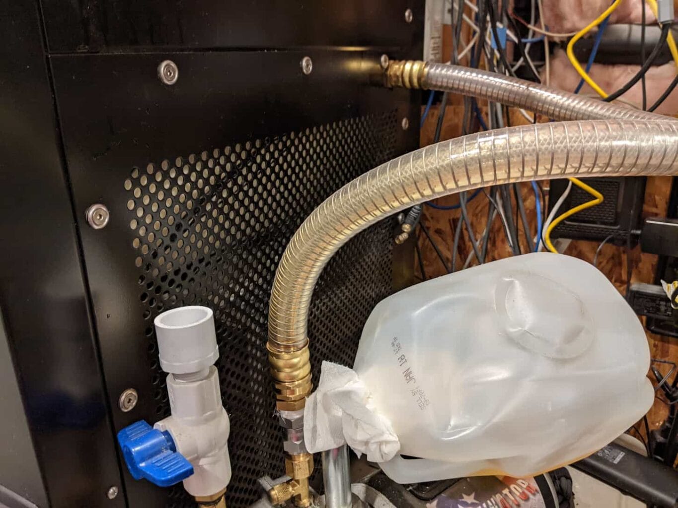 An image of our drain valve on the freeze-dryer, located on the side, toward the bottom back.