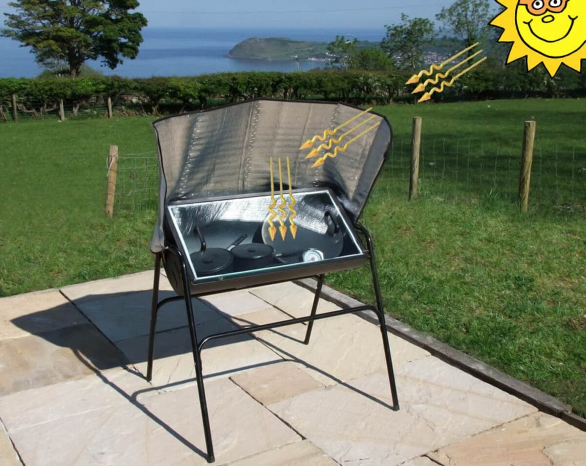 An image of a BBQ grill converted into a solar-powered dehydrator and cooker.